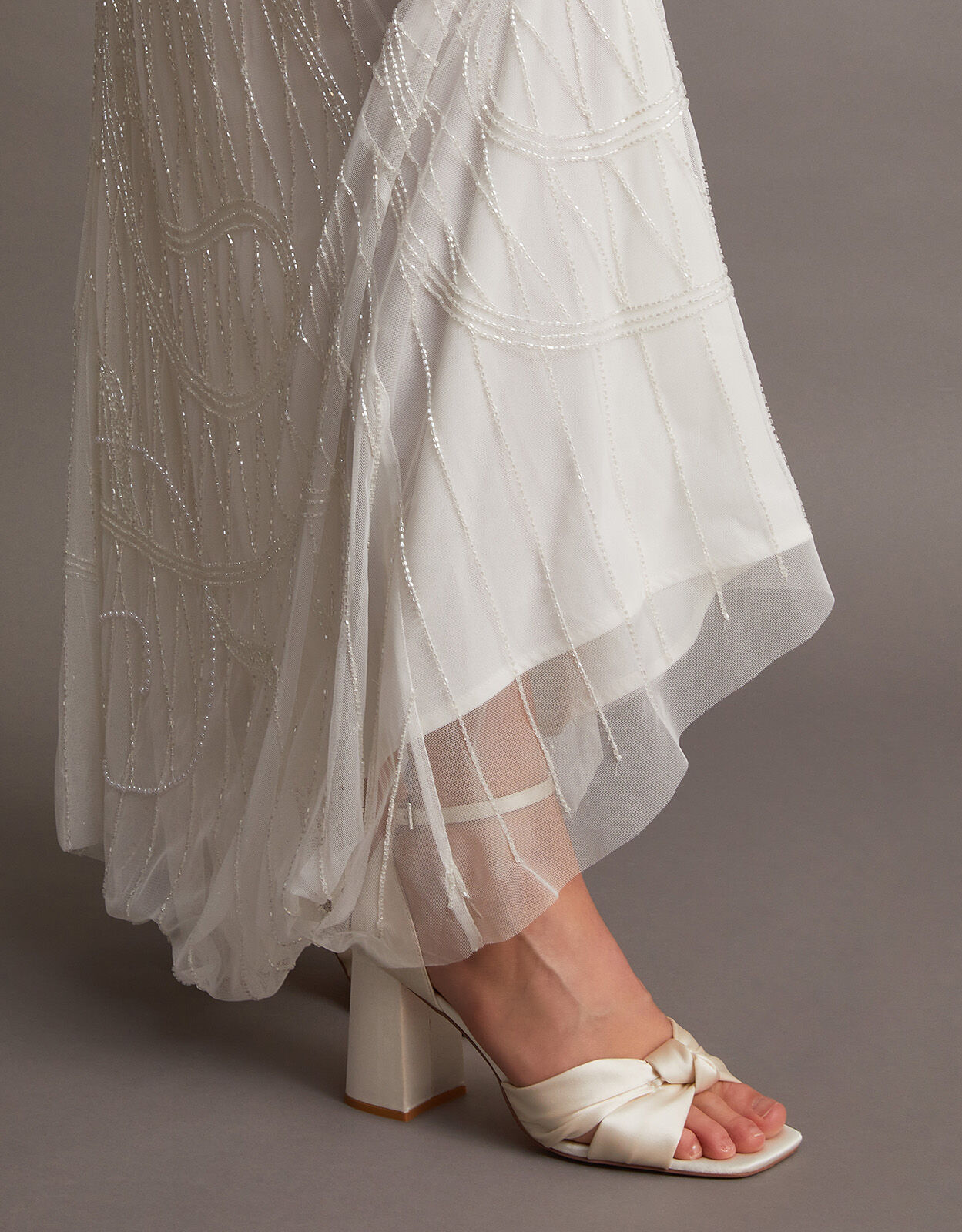 Premium Photo | The bride is putting on wedding sandals